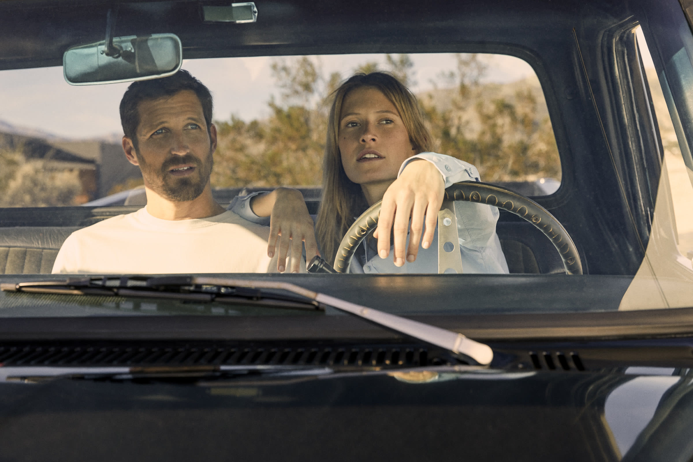 Campaign, couple inside a vintage truck