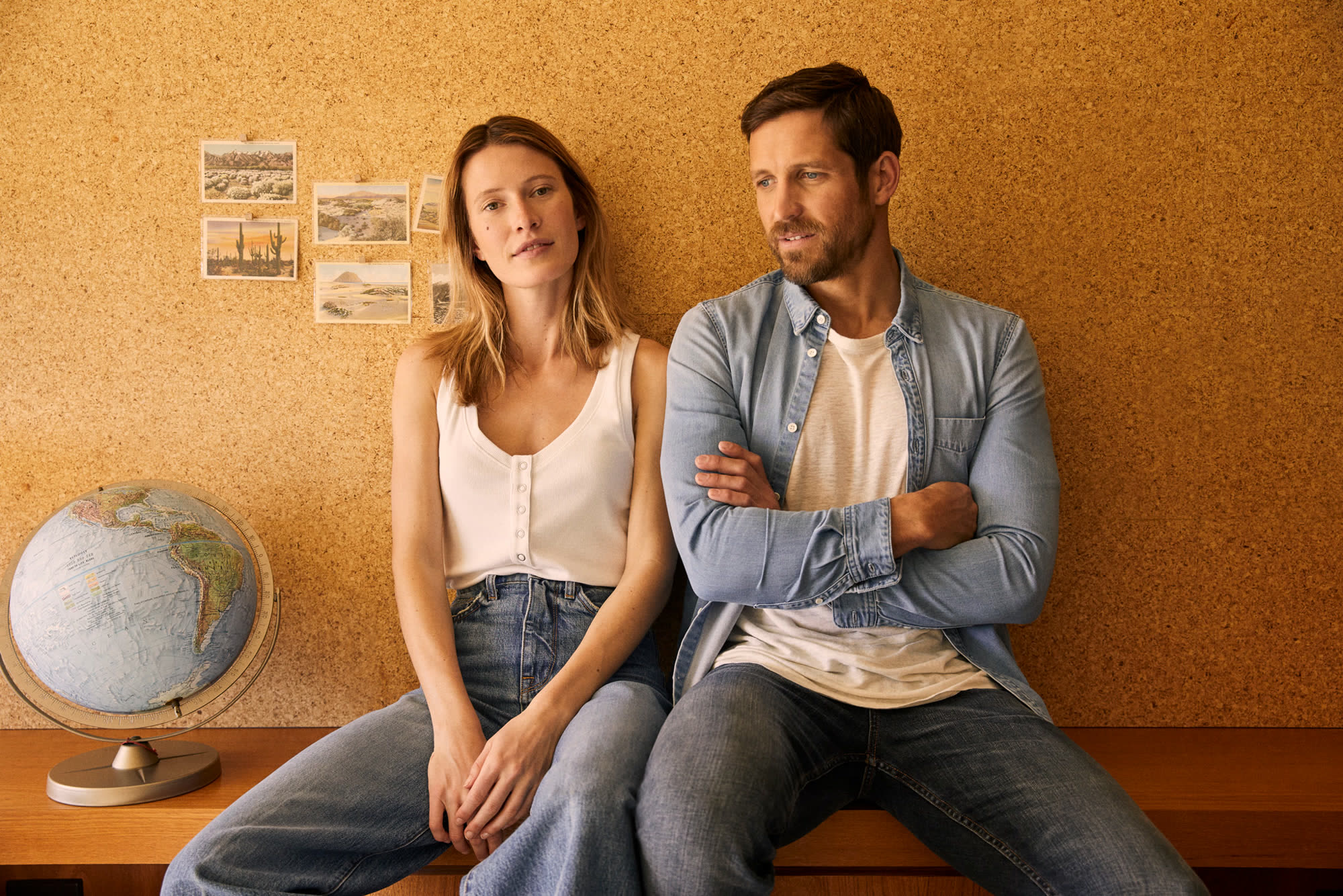 Campaign interior, couple against cork wall